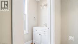 Bathroom with vanity and baseboards - 
