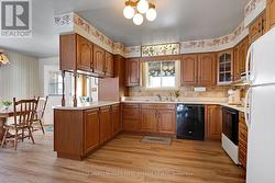 Wrap-about oak cabinets & ceramic backsplash - 