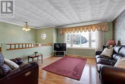 Living room gleaming oak flooring &  huge window - 