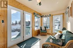 Sunroom walls of windows; door to deck for BBQing - 