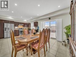 Dining room featuring light tile patterned floors and recessed lighting - 