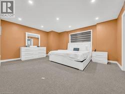 Carpeted bedroom featuring recessed lighting and baseboards - 