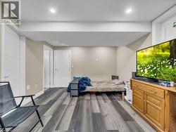 Sitting room with dark wood-style floors and recessed lighting - 