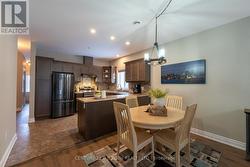 Kitchen and dining room with upgraded pot lights - 