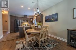 Large dining room with upgraded light fixtures - 