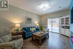 Living room with walkout to private deck - 