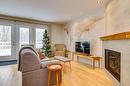 Living room - 302-556 Ch. Réal, Sutton, QC  - Indoor Photo Showing Living Room With Fireplace 