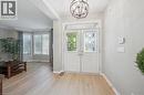 Foyer with a chandelier, arches, and Living Room with large windows - 79 Zieman Crescent, Cambridge, ON  - Indoor Photo Showing Other Room 