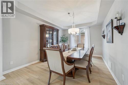 Dining space featuring coffered ceiling, light floors, and plenty of space for large dinners - 79 Zieman Crescent, Cambridge, ON - Indoor Photo Showing Dining Room