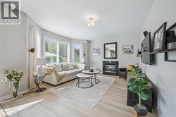 Family room with gas fireplace open to kitchen - 