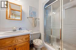 Full bathroom with a stall shower and vanity - 