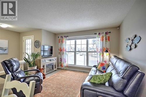 388 Auburn Crest Way Se, Calgary, AB - Indoor Photo Showing Living Room With Fireplace