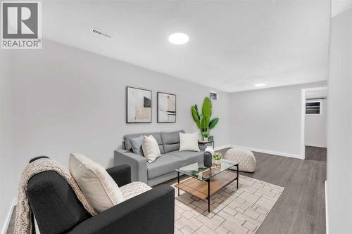 5868 Dalcastle Drive Nw, Calgary, AB - Indoor Photo Showing Living Room