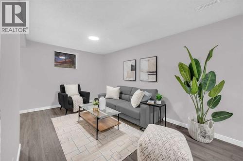 5868 Dalcastle Drive Nw, Calgary, AB - Indoor Photo Showing Living Room
