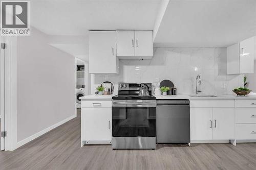 5868 Dalcastle Drive Nw, Calgary, AB - Indoor Photo Showing Kitchen With Upgraded Kitchen