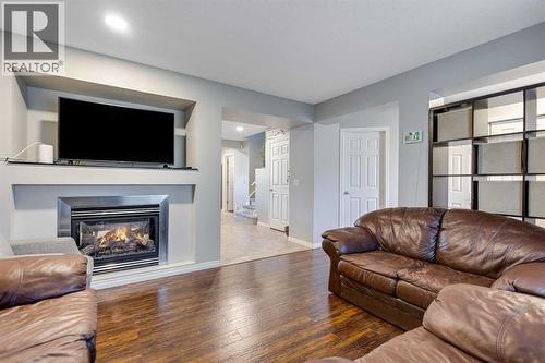 36 Bridlecrest Street Sw, Calgary, AB - Indoor Photo Showing Living Room With Fireplace