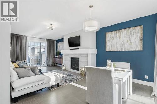 16 Treeline Lane Sw, Calgary, AB - Indoor Photo Showing Living Room With Fireplace