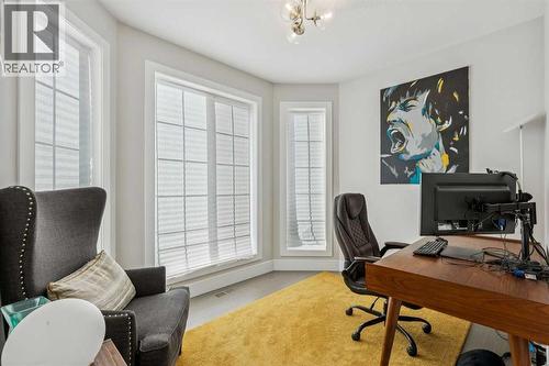 Main floor flex space overlooking greensapce - 16 Treeline Lane Sw, Calgary, AB - Indoor Photo Showing Office