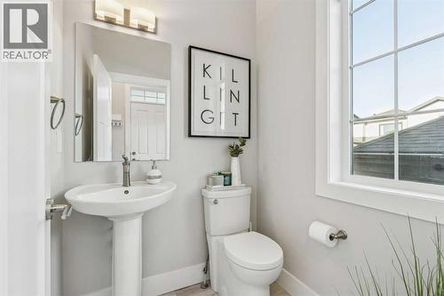 main  floor powder room - 16 Treeline Lane Sw, Calgary, AB - Indoor Photo Showing Bathroom