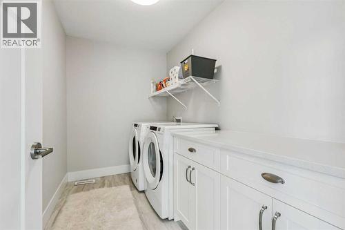 laundry - 16 Treeline Lane Sw, Calgary, AB - Indoor Photo Showing Laundry Room