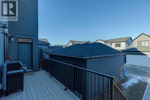 back porch overlooking garage and yard - 16 Treeline Lane Sw, Calgary, AB - Outdoor