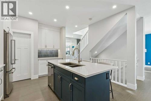 16 Treeline Lane Sw, Calgary, AB - Indoor Photo Showing Kitchen With Double Sink