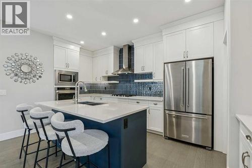 16 Treeline Lane Sw, Calgary, AB - Indoor Photo Showing Kitchen With Stainless Steel Kitchen With Double Sink With Upgraded Kitchen