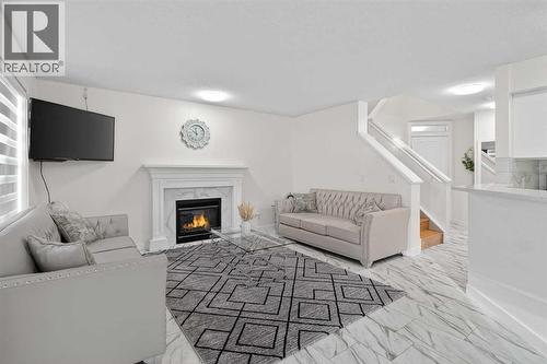 143 Taralake Way Ne, Calgary, AB - Indoor Photo Showing Living Room With Fireplace