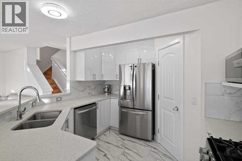 143 Taralake Way Ne, Calgary, AB - Indoor Photo Showing Kitchen With Double Sink