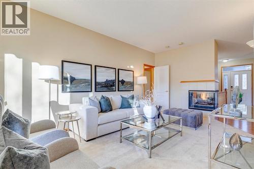 15875 Shannon Link Sw, Calgary, AB - Indoor Photo Showing Living Room With Fireplace