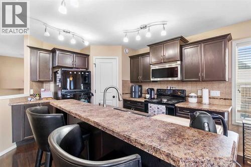 22 Morton Close, Penhold, AB - Indoor Photo Showing Kitchen With Upgraded Kitchen