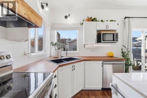 15029 5 Street Sw, Calgary, AB - Indoor Photo Showing Kitchen With Double Sink