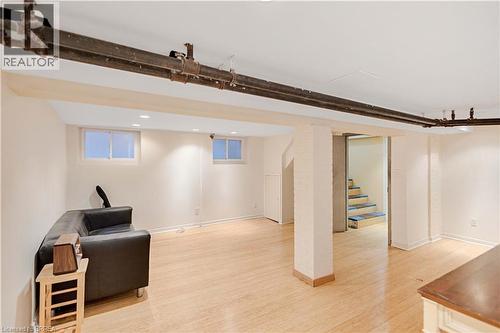 Living area with light wood-style floors, stairway, and recessed lighting - 134 Sherman Avenue S, Hamilton, ON - Indoor Photo Showing Other Room
