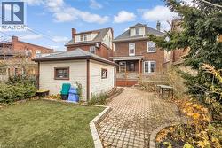 Rear view of house with brick siding - 