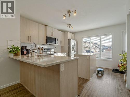 702, 210 Firelight Way W, Lethbridge, AB - Indoor Photo Showing Kitchen With Upgraded Kitchen