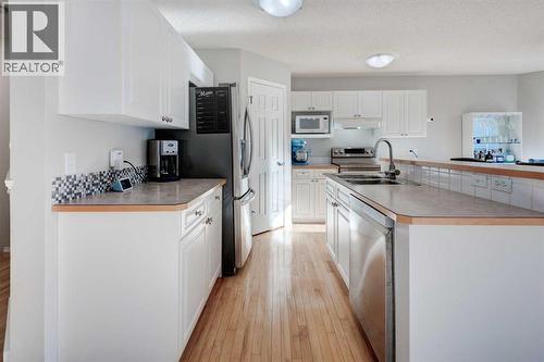 239 Chapalina Place Se, Calgary, AB - Indoor Photo Showing Kitchen With Double Sink