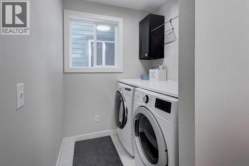 239 Chapalina Place Se, Calgary, AB - Indoor Photo Showing Laundry Room