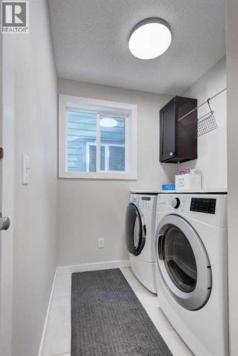 239 Chapalina Place Se, Calgary, AB - Indoor Photo Showing Laundry Room