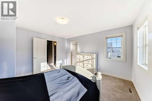 49 Crestridge View Sw, Calgary, AB - Indoor Photo Showing Bedroom
