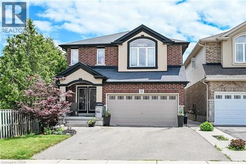 Brick and stucco facade with dark trim accents - 71 Jessica Street, Hamilton, ON - Outdoor With Facade
