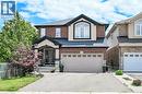 Brick and stucco facade with dark trim accents - 71 Jessica Street, Hamilton, ON  - Outdoor With Facade 