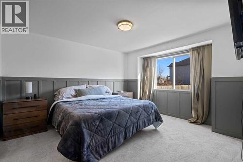 21 Wilson Road Ne, Langdon, AB - Indoor Photo Showing Bedroom