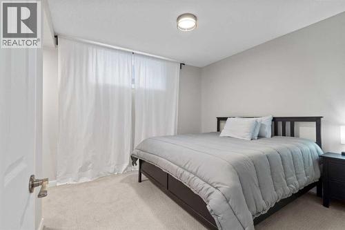 21 Wilson Road Ne, Langdon, AB - Indoor Photo Showing Bedroom