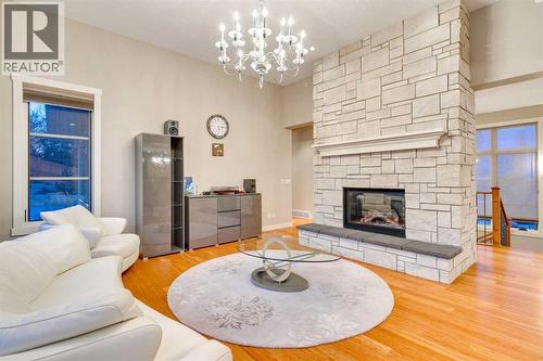215 Patton Court Sw, Calgary, AB - Indoor Photo Showing Living Room With Fireplace