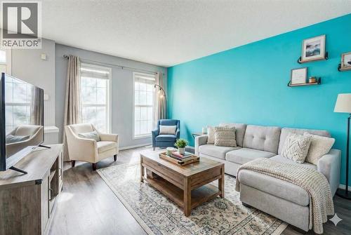 Virtually staged living room - 16 Elgin Bay Se, Calgary, AB - Indoor Photo Showing Living Room