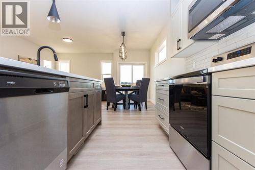 Photos and renderings are examples from a similar home built previously and do not necessarily reflect finished and colours used in this home - 41 Terra Close, Red Deer, AB - Indoor Photo Showing Kitchen