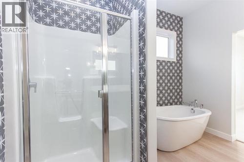 Photos and renderings are examples from a similar home built previously and do not necessarily reflect finished and colours used in this home - 41 Terra Close, Red Deer, AB - Indoor Photo Showing Bathroom