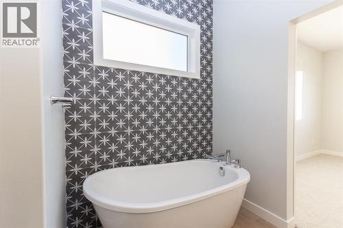 Photos and renderings are examples from a similar home built previously and do not necessarily reflect finished and colours used in this home - 41 Terra Close, Red Deer, AB - Indoor Photo Showing Bathroom