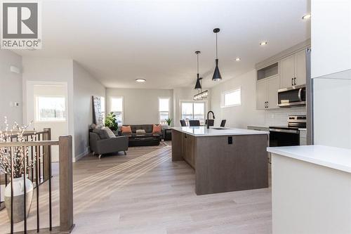 Photos and renderings are examples from a similar home built previously and do not necessarily reflect finished and colours used in this home - 41 Terra Close, Red Deer, AB - Indoor Photo Showing Kitchen With Upgraded Kitchen