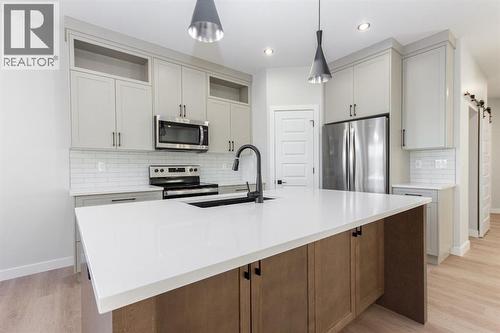 Photos and renderings are examples from a similar home built previously and do not necessarily reflect finished and colours used in this home - 41 Terra Close, Red Deer, AB - Indoor Photo Showing Kitchen With Stainless Steel Kitchen With Upgraded Kitchen